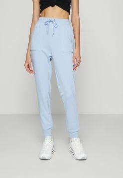 PAMELA REIF X NA-KD - TRACKSUIT BOTTOMS - Pantalon De Survêtement - Dusty Blue