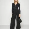 NA-KD WIDE PLEATED PANTS - Pantalon Classique - Black -NA-KD Soldes Magasin 8fc625e825cf44a69b8d5e42742bbdc7